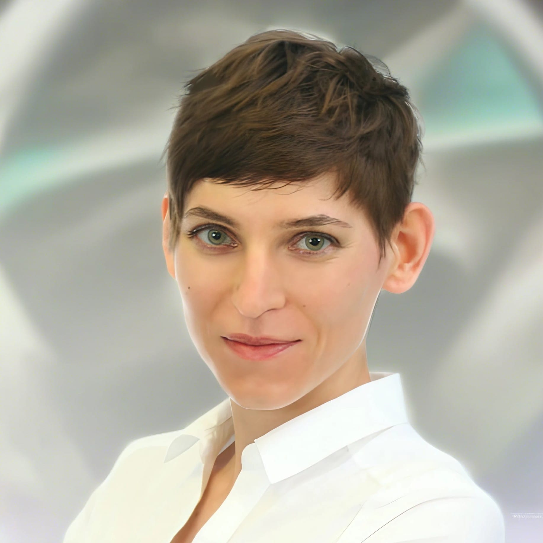 Woman with short hair, white shirt, smiling